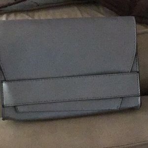 I am selling a gray clutch from Summer and Rose